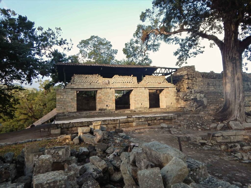 Stone palace ruins at the Copán UNESCO archaeological site, featured on a Copán day tour from Guatemala City by air — ideal for travelers who fly from Guatemala to Copán to explore ancient Maya history.
