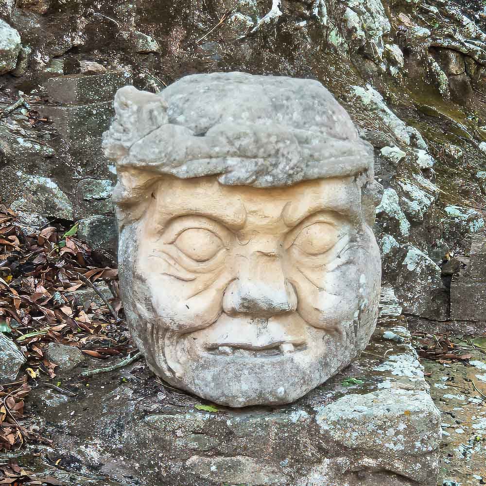 Old-man's-Head Stone head of the Old Man at Copán Archaeological Site – fly Guatemala to Copán Ruinas